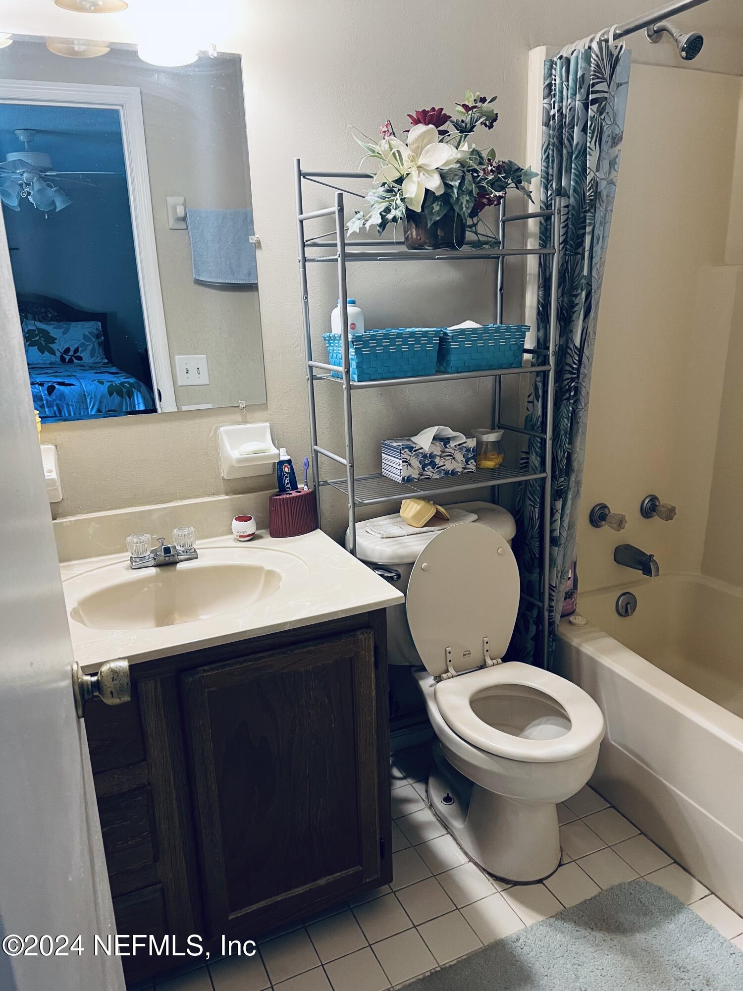 11375 Pine Loop Glen St. Mary, FL 32040 - Photo 13 of 17 a bathroom with a sink toilet and shower