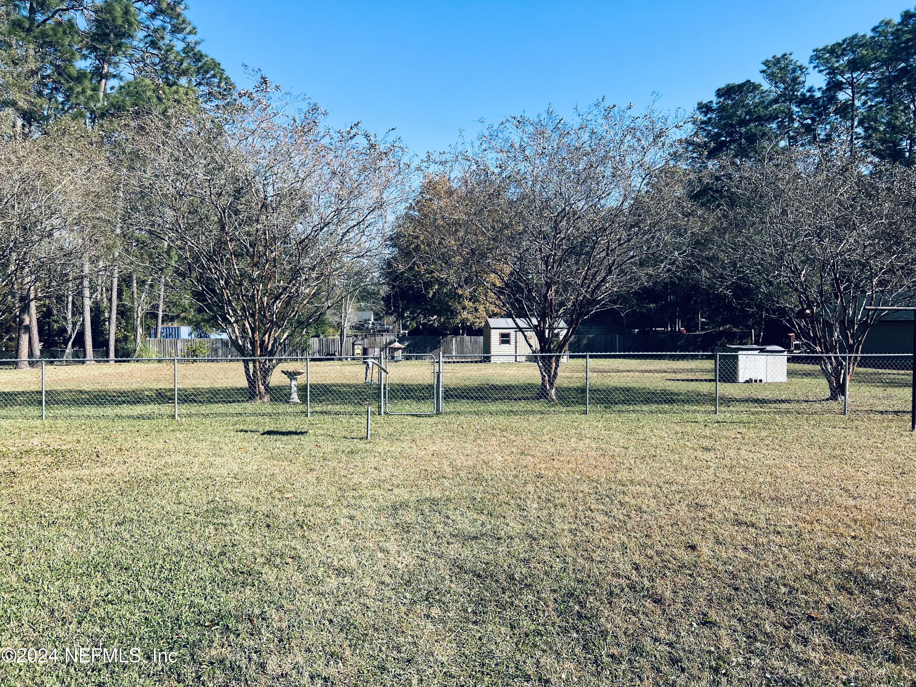 11375 Pine Loop Glen St. Mary, FL 32040 - Photo 15 of 17 a view of a park with tree s
