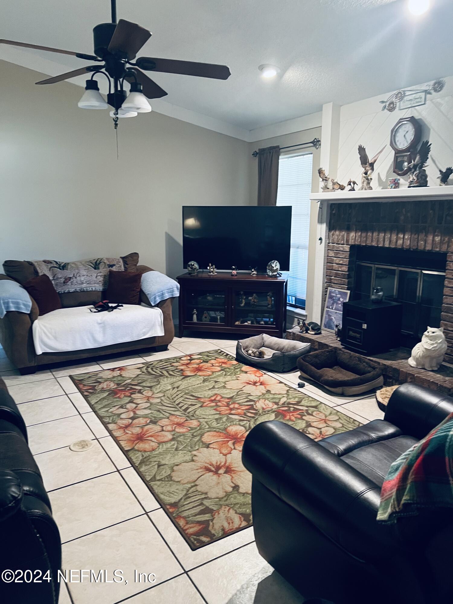 11375 Pine Loop Glen St. Mary, FL 32040 - Photo 3 of 17 a living room with furniture and a fireplace