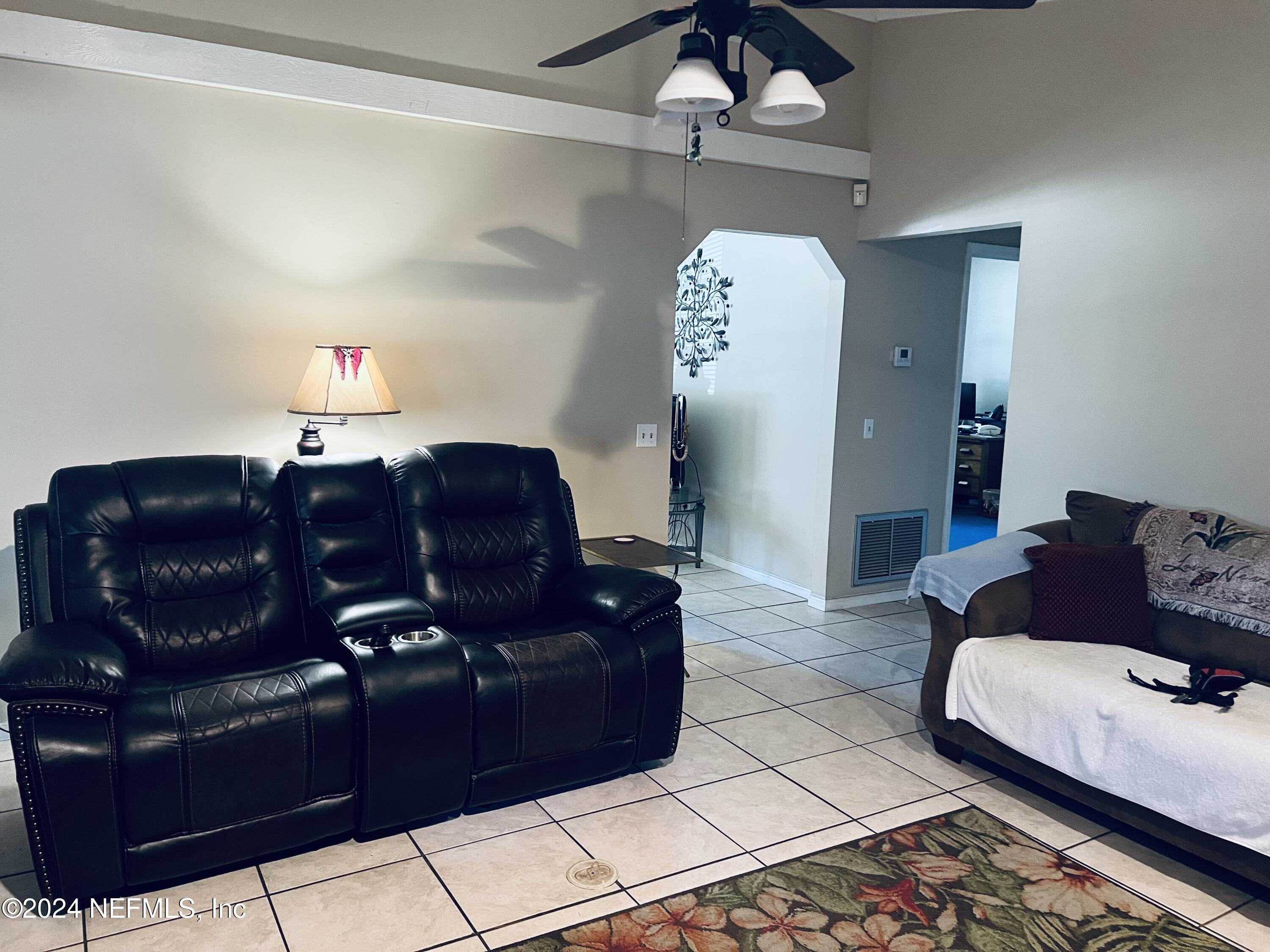 11375 Pine Loop Glen St. Mary, FL 32040 - Photo 4 of 17 a living room with couches and furniture