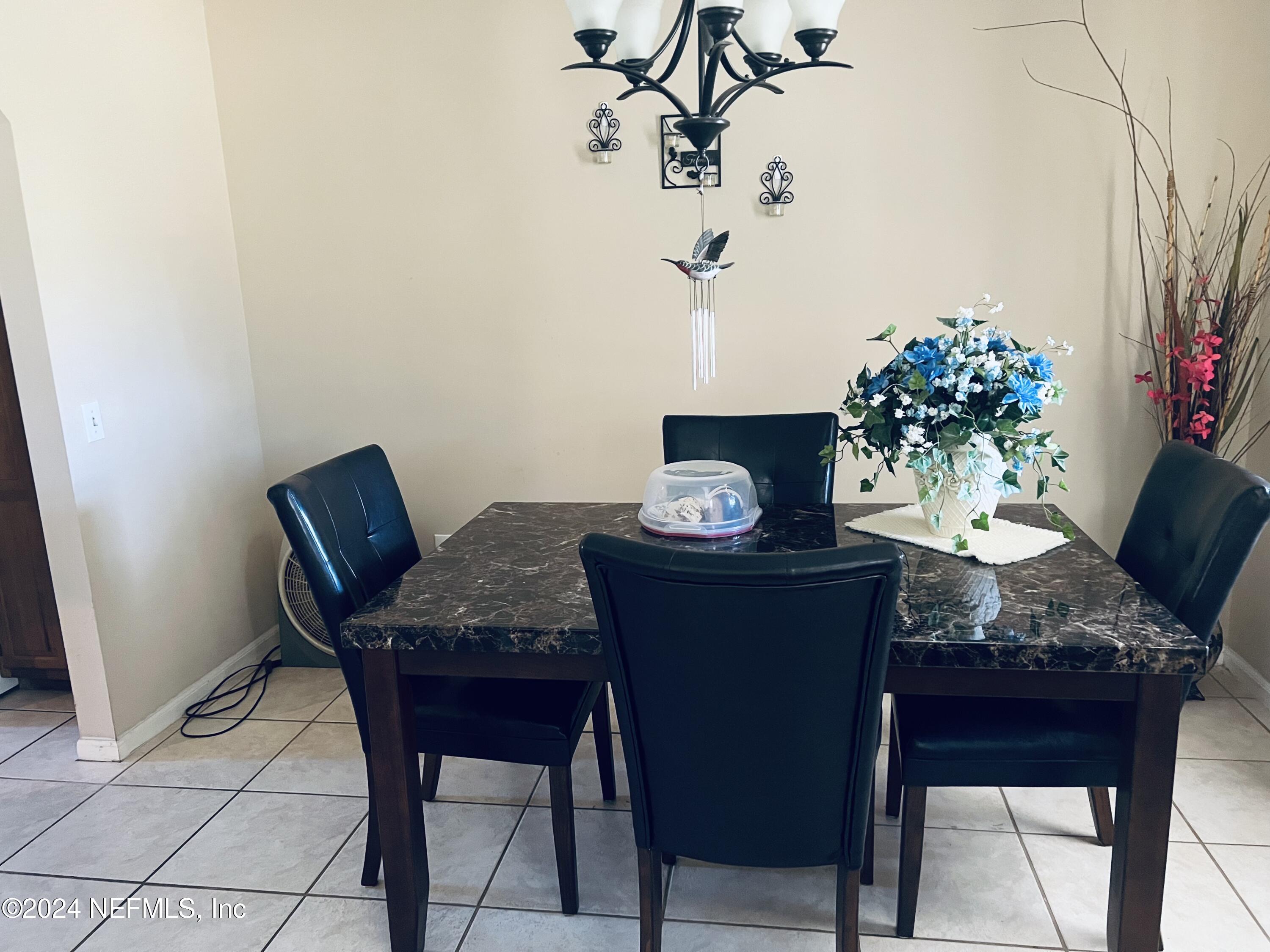 11375 Pine Loop Glen St. Mary, FL 32040 - Photo 8 of 17 a dining room with furniture and wooden floor