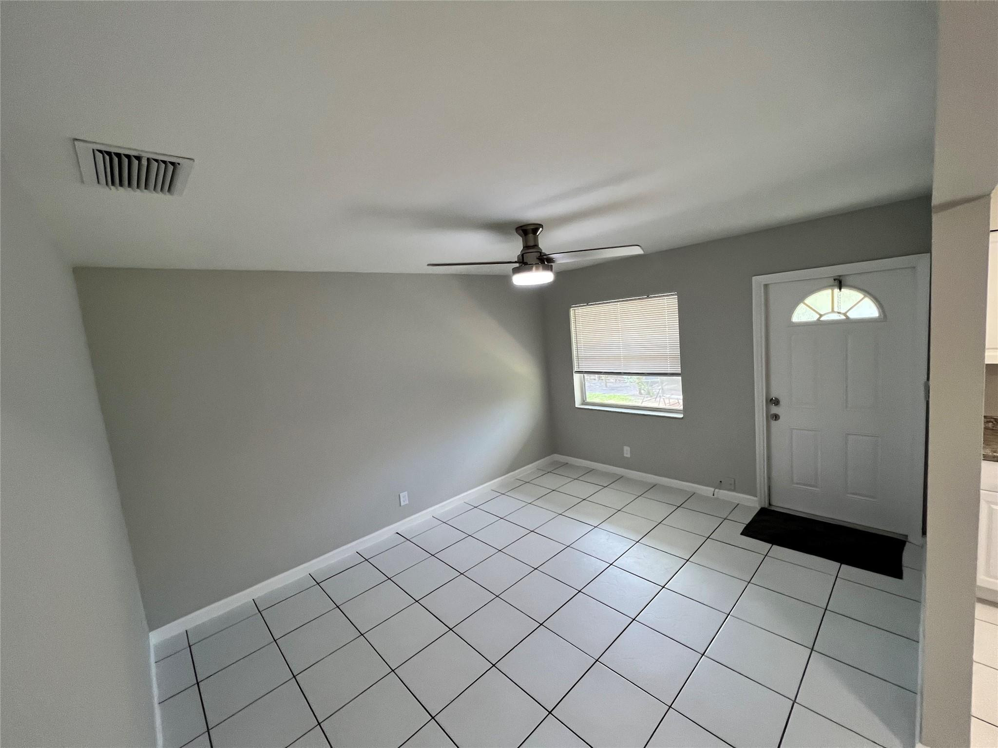 121 Southwest 15th Street, Unit C Pompano Beach, FL 33060 - Photo 5 of 13 a view of an empty room