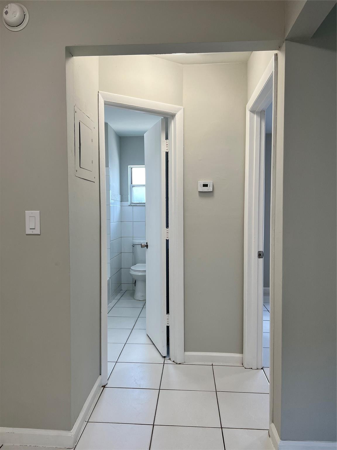 121 Southwest 15th Street, Unit C Pompano Beach, FL 33060 - Photo 8 of 13 a view of a hallway to rooms