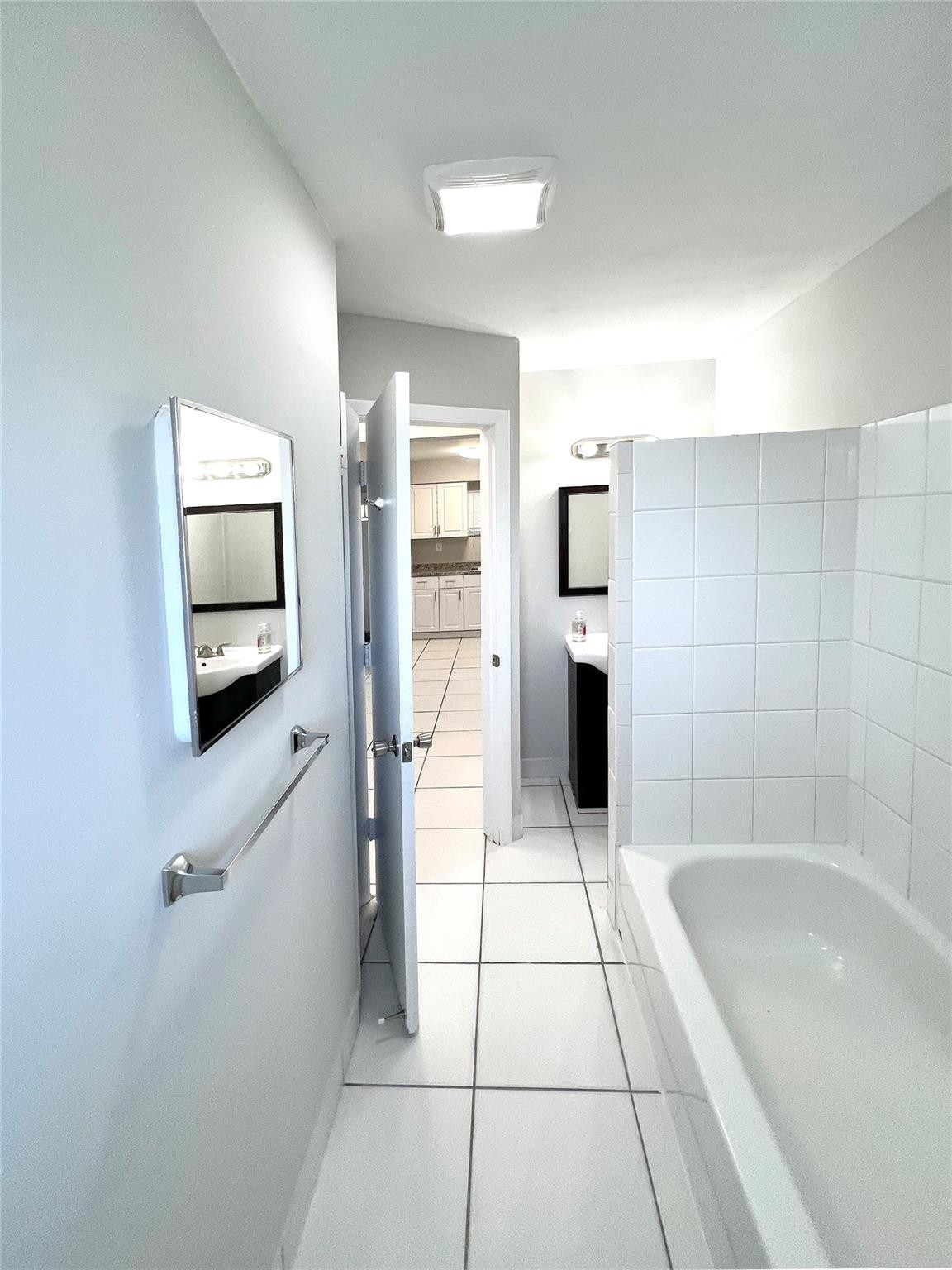 121 Southwest 15th Street, Unit C Pompano Beach, FL 33060 - Photo 9 of 13 a bathroom with a bathtub and a shower