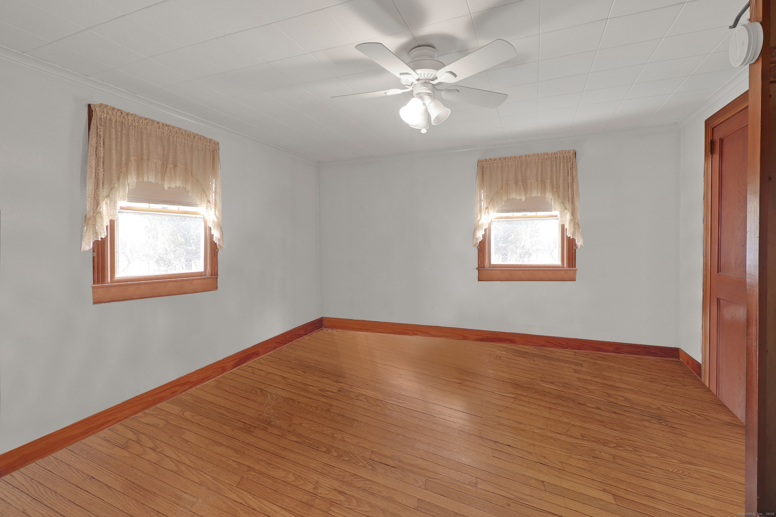 60 Frost Street Southington, CT 06479 - Photo 23 of 35 a view of an empty room with wooden floor and a window