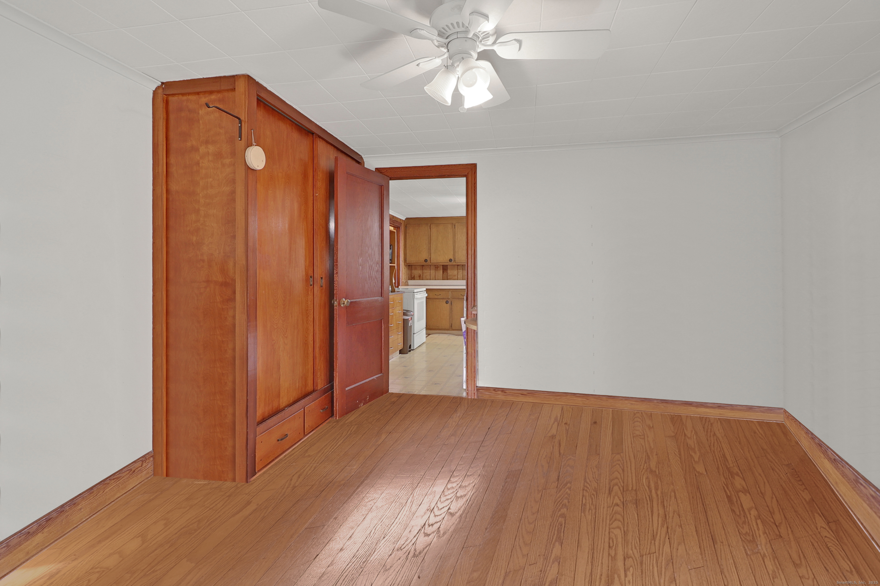 60 Frost Street Southington, CT 06479 - Photo 25 of 35 an empty room with wooden floor closet and windows