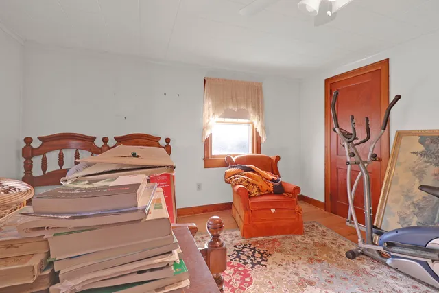 a kitchen with a table chairs sink and cabinets