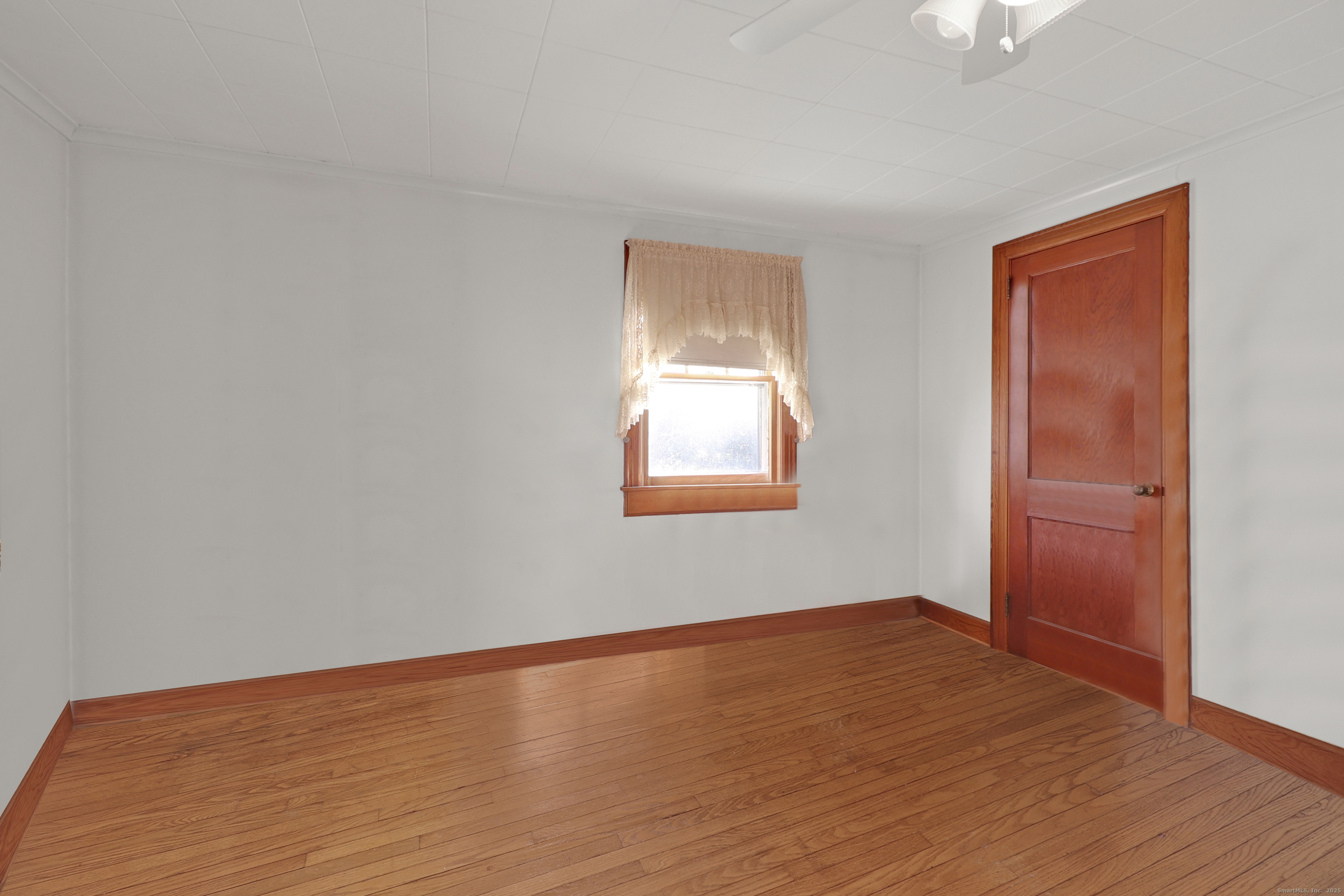 60 Frost Street Southington, CT 06479 - Photo 27 of 35 a view of an empty room with wooden floor and a window