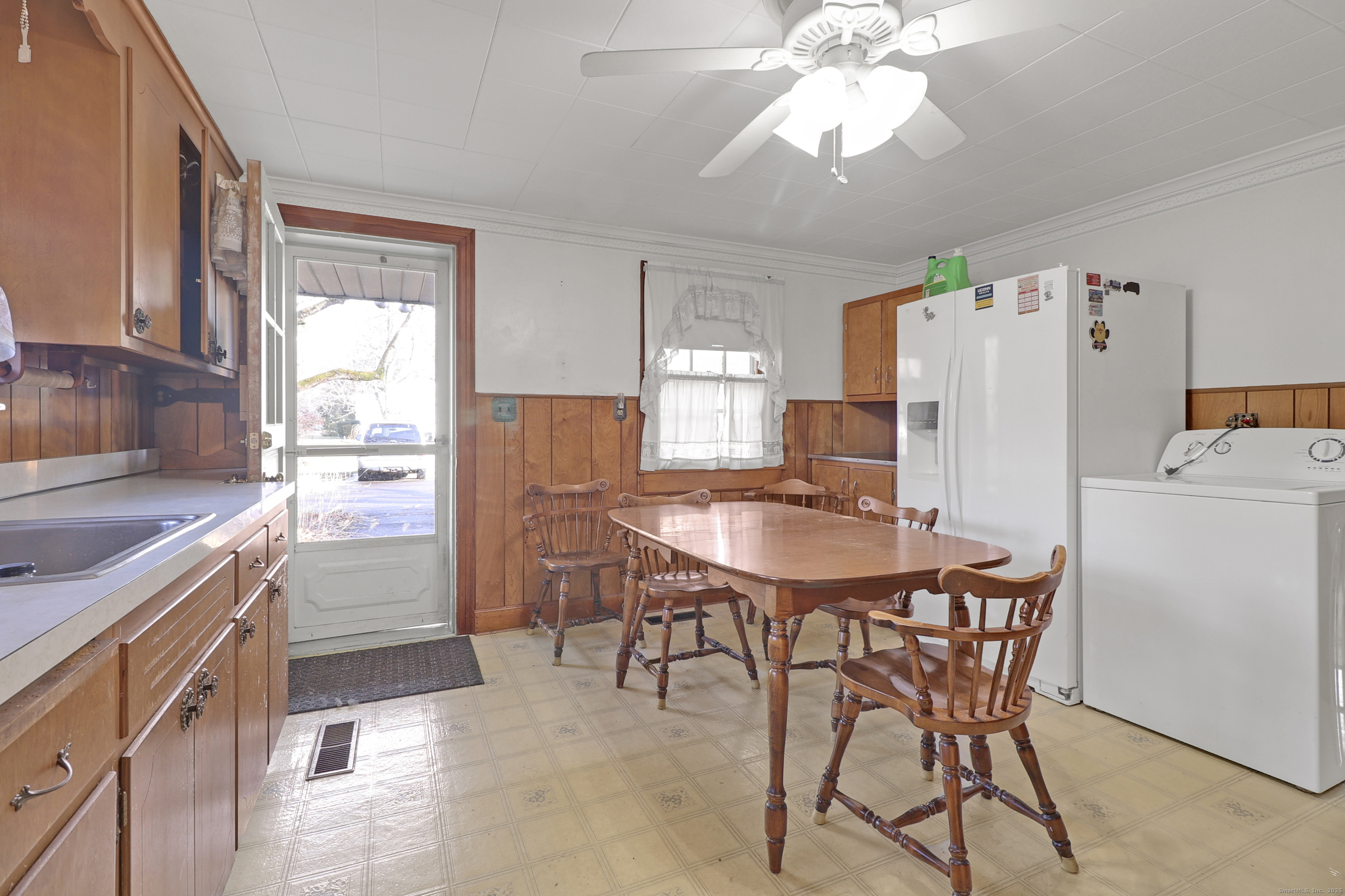 60 Frost Street Southington, CT 06479 - Photo 29 of 35 a kitchen with refrigerator a stove a table and chairs