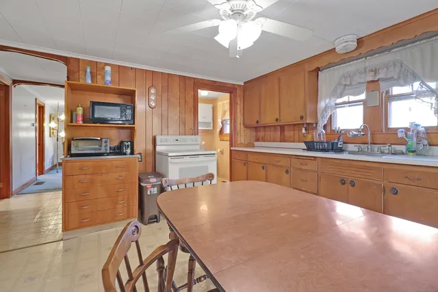a white toilet sitting next to a bathroom sink
