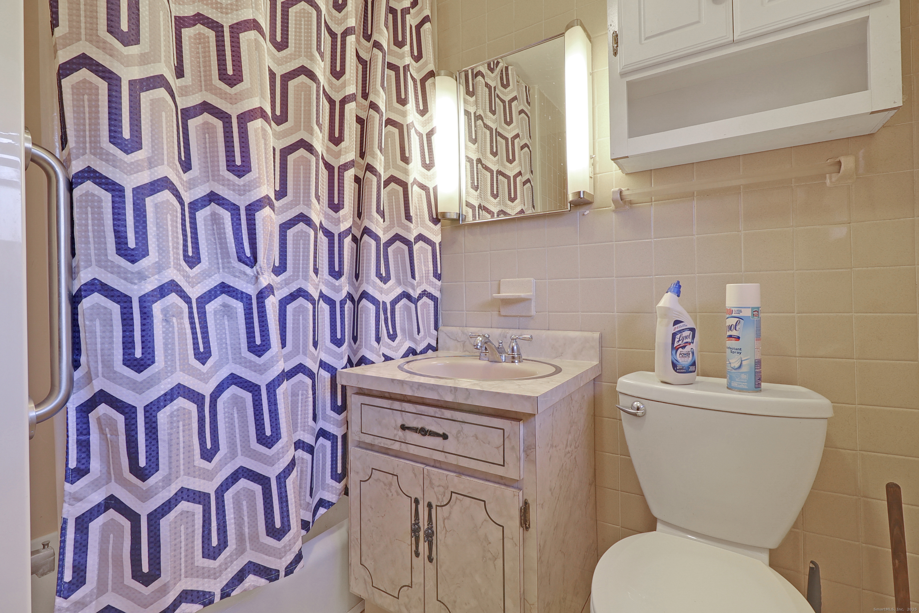 60 Frost Street Southington, CT 06479 - Photo 33 of 35 a white toilet sitting next to a bathroom sink