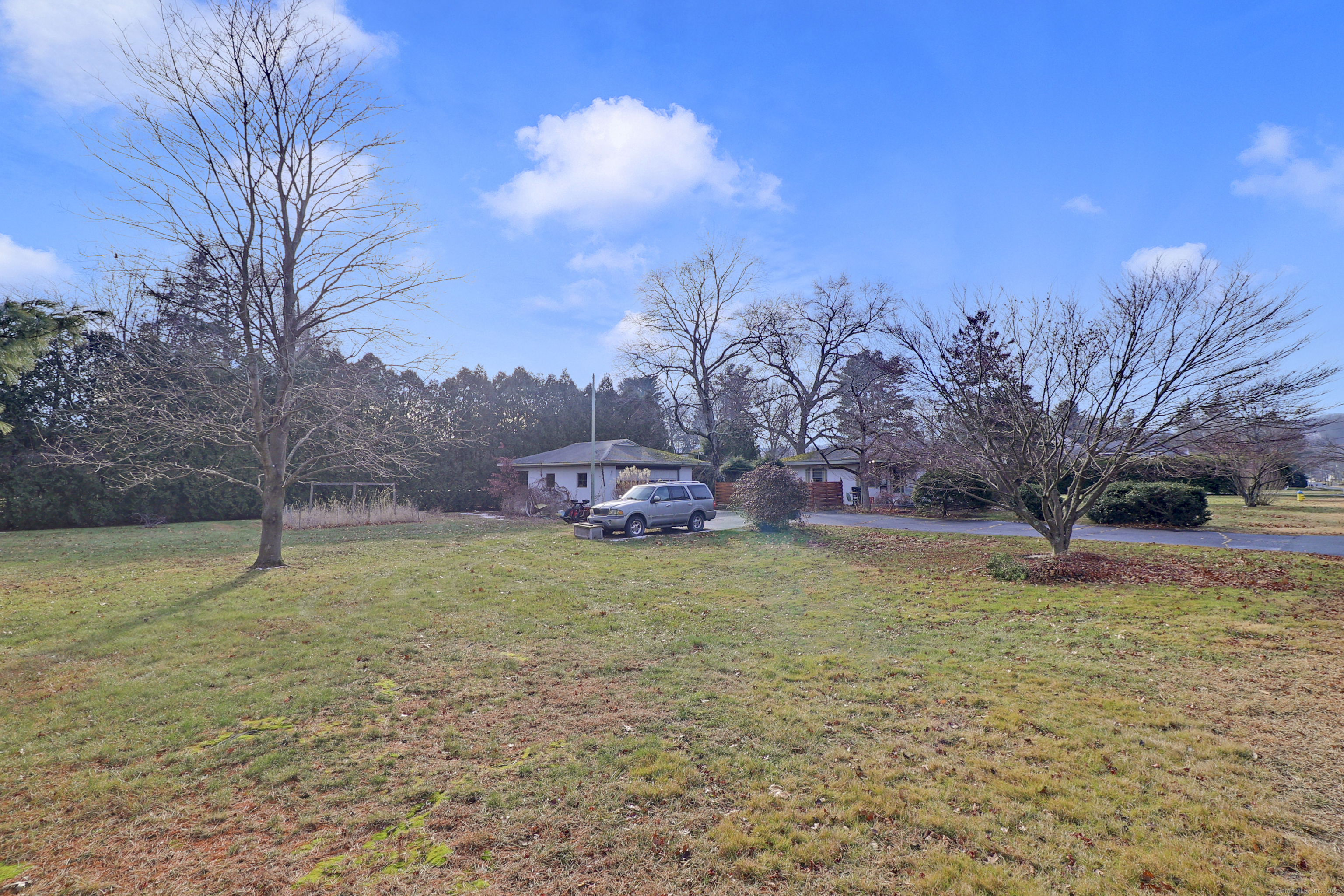 60 Frost Street Southington, CT 06479 - Photo 7 of 35 a view of a backyard with large trees