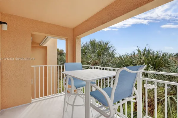 a view of an outside dining space with furniture
