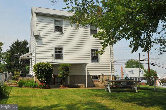1253 Elm Road Baltimore, MD 21227 - Photo 14 of 29 a front view of house with yard