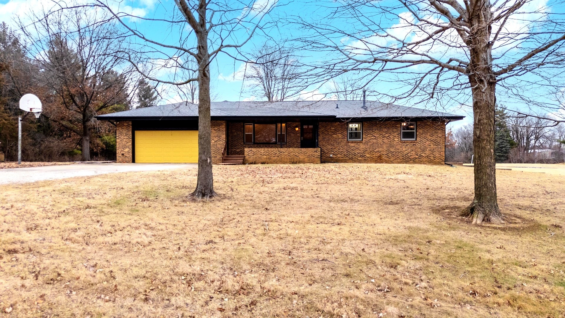 2804 Hendrix Drive Bloomington, IL 61704 - Photo 12 of 71 a house with trees in front of it