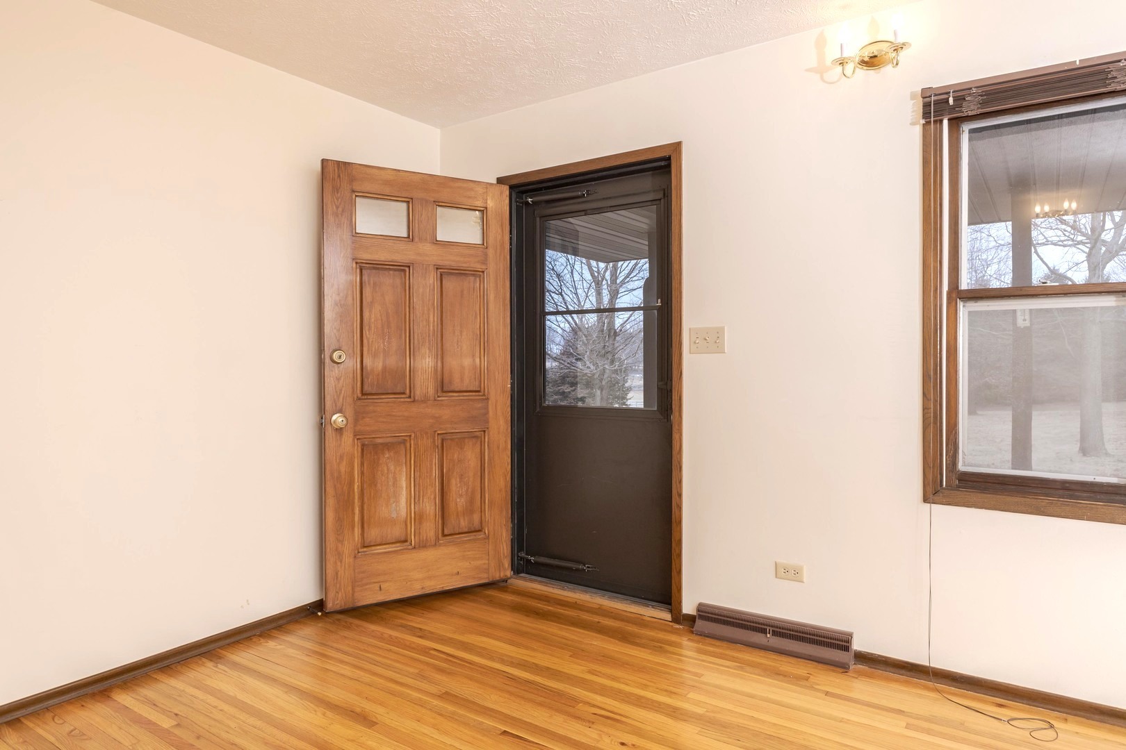 2804 Hendrix Drive Bloomington, IL 61704 - Photo 14 of 71 a view of an empty room with wooden floor and a window