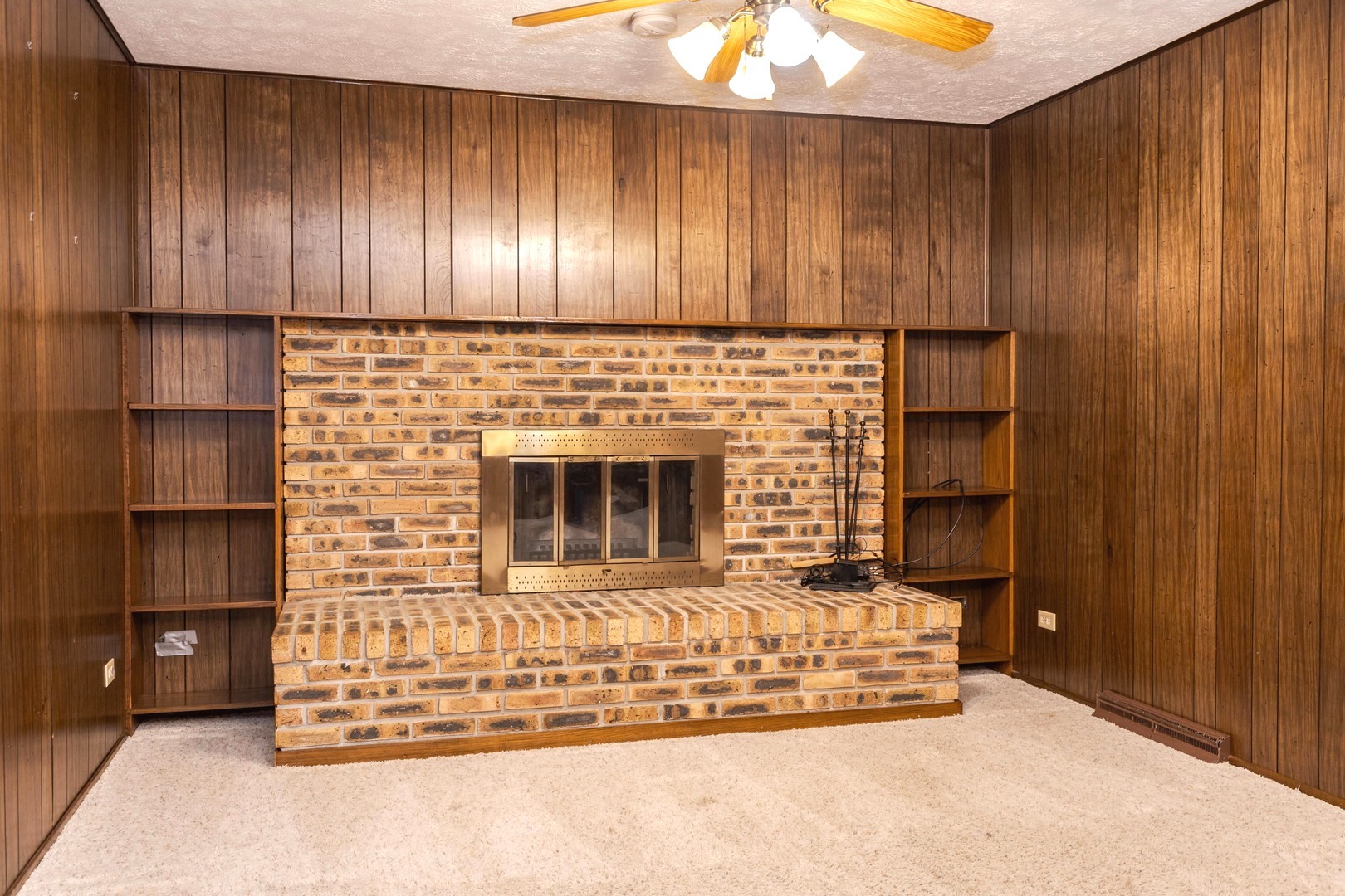 2804 Hendrix Drive Bloomington, IL 61704 - Photo 25 of 71 a kitchen with wooden cabinets and a fireplace