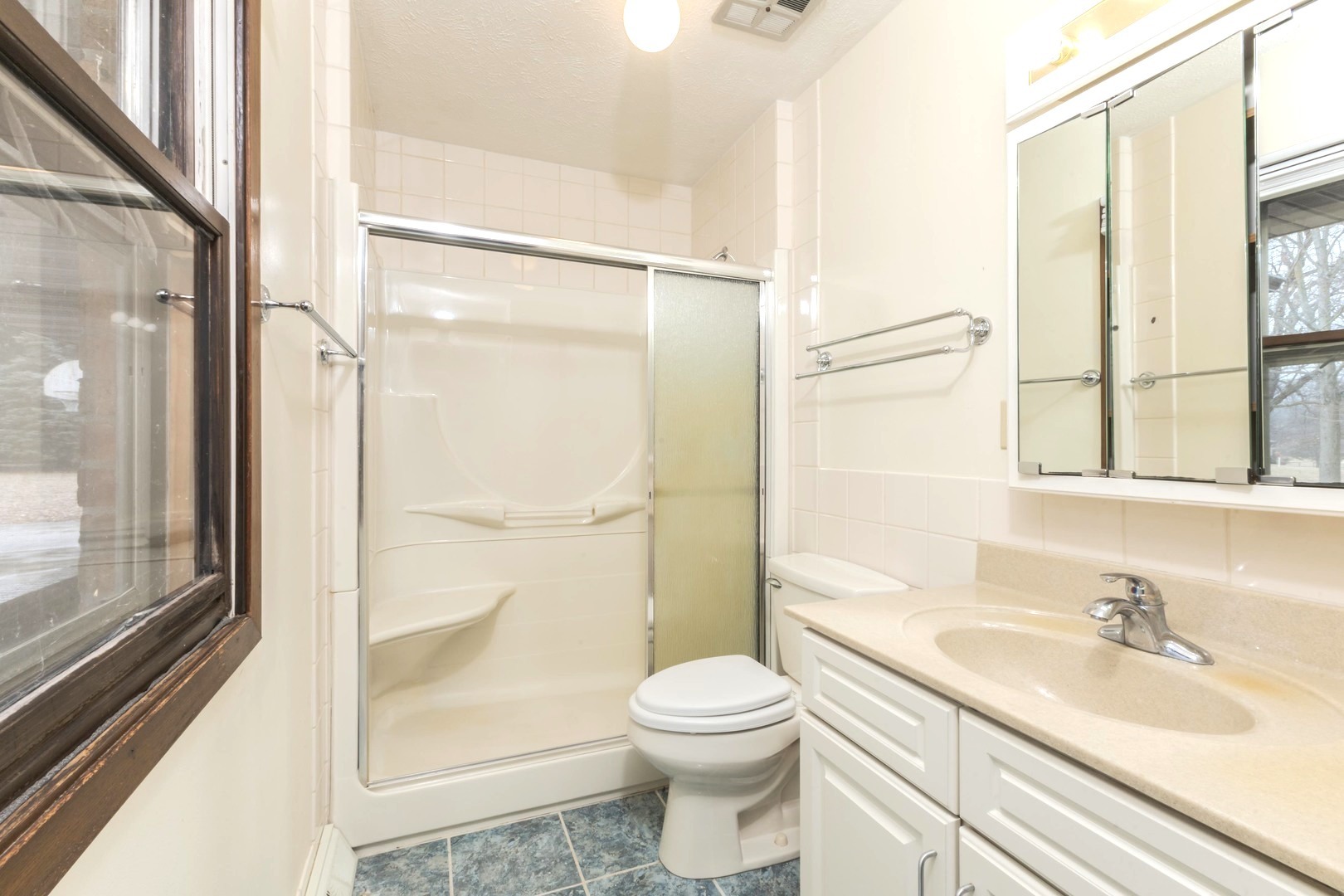 2804 Hendrix Drive Bloomington, IL 61704 - Photo 33 of 71 a bathroom with a sink a toilet and shower
