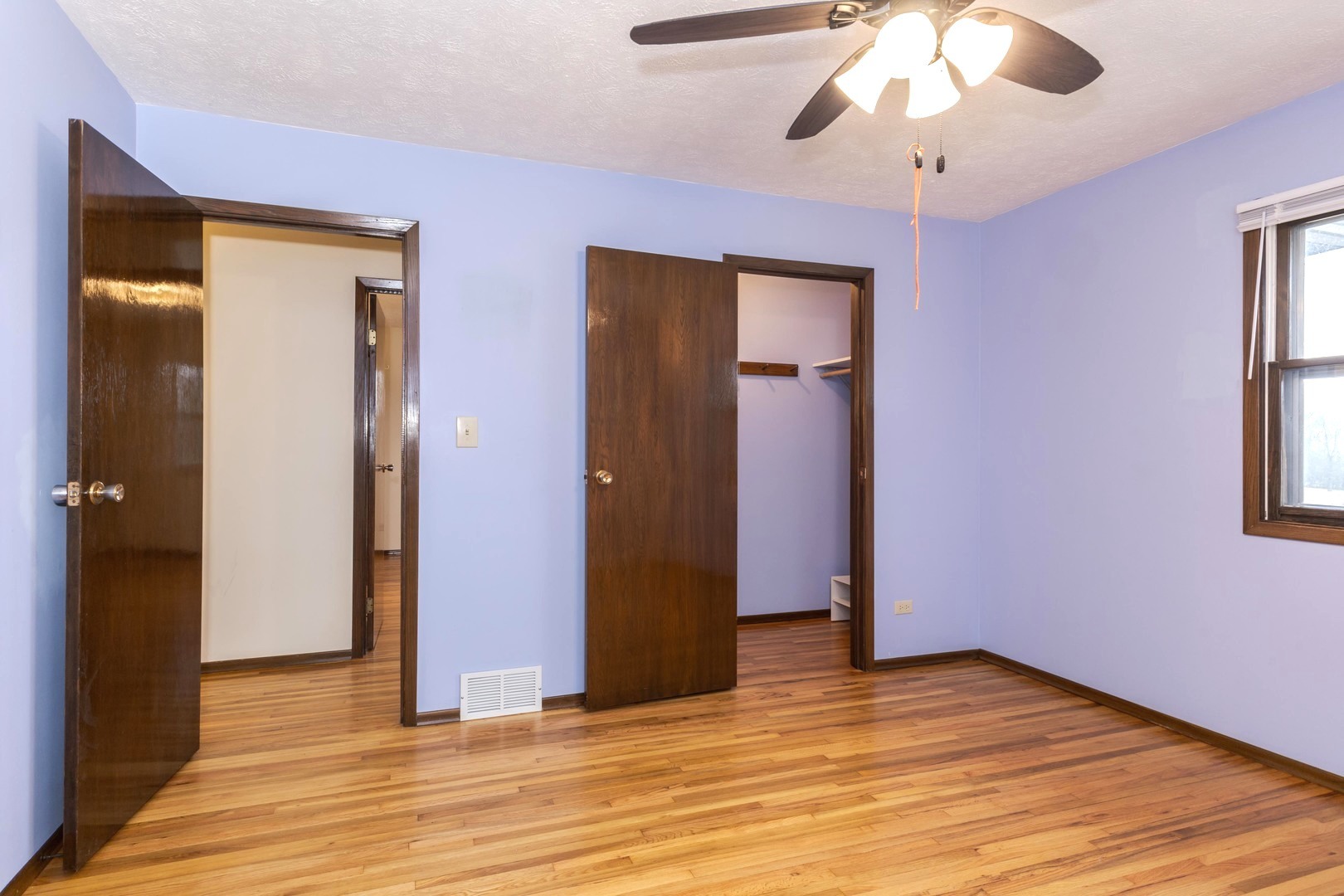 2804 Hendrix Drive Bloomington, IL 61704 - Photo 34 of 71 a view of an empty room with wooden floor and a window
