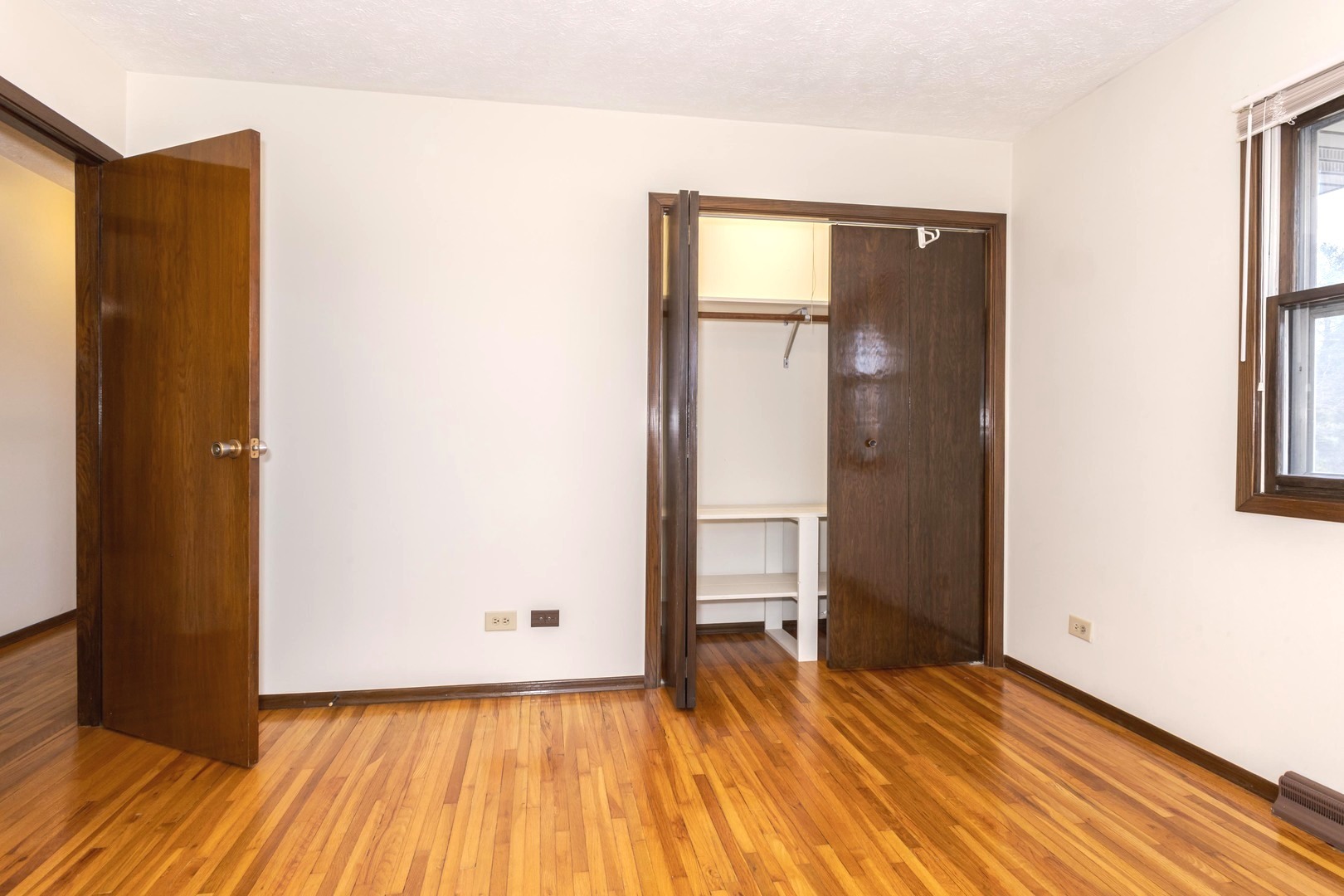 2804 Hendrix Drive Bloomington, IL 61704 - Photo 36 of 71 a view of a room with wooden floor and a bathroom