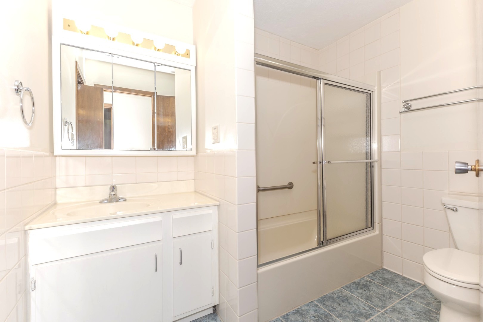 2804 Hendrix Drive Bloomington, IL 61704 - Photo 39 of 71 a bathroom with a sink a toilet and shower