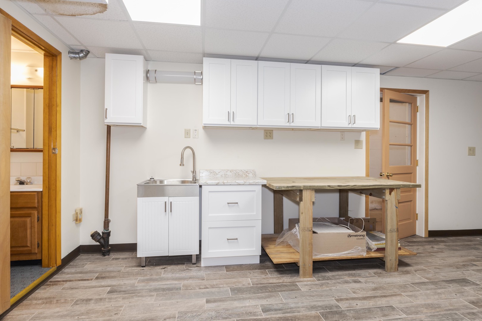 2804 Hendrix Drive Bloomington, IL 61704 - Photo 42 of 71 a kitchen with cabinets and wooden floor
