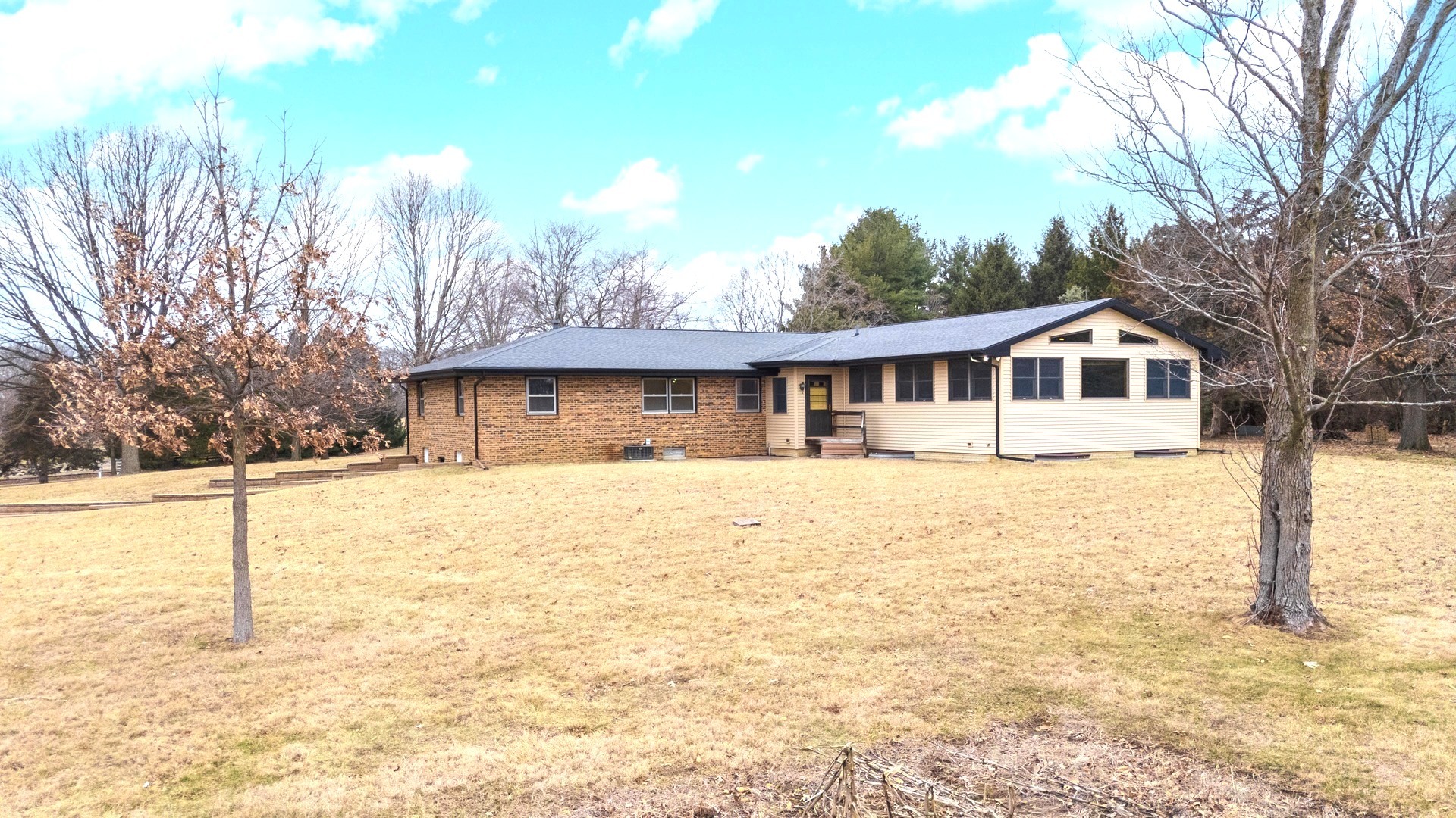 2804 Hendrix Drive Bloomington, IL 61704 - Photo 56 of 71 a front view of a house with a yard