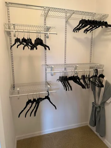 a spacious bathroom with a double vanity sink and a mirror