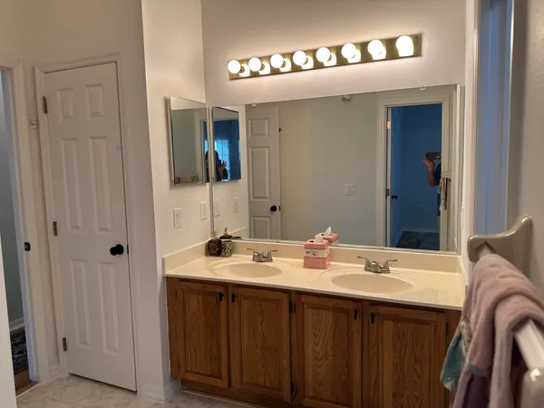 a bathroom with a toilet and a rug