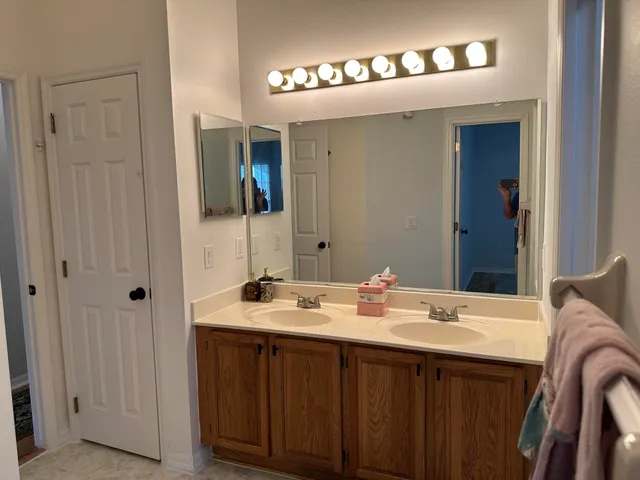 a bathroom with a toilet and a rug