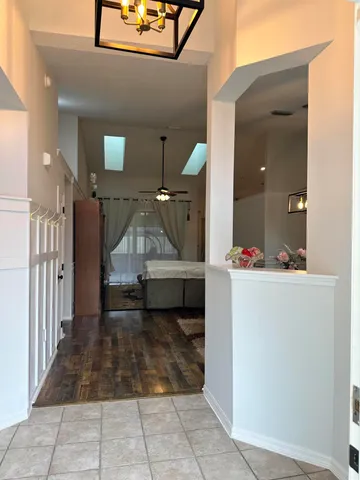 a view of a hallway with a living room