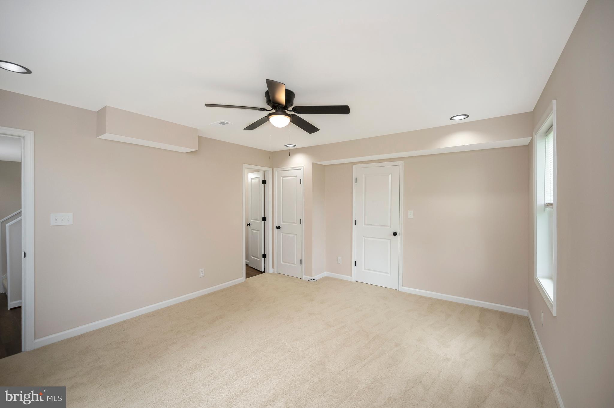 14169 Silver Hill Road Sumerduck, VA 22742 - Photo 18 of 40 a view of a livingroom with a ceiling fan and window
