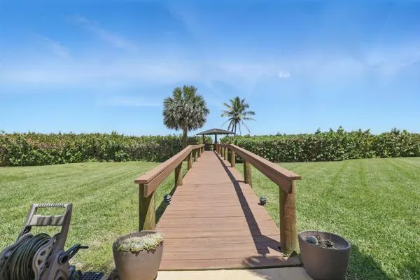 a view of a lake with a floor to ceiling window
