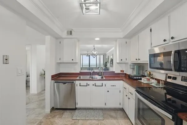 a kitchen with a sink stove and cabinets