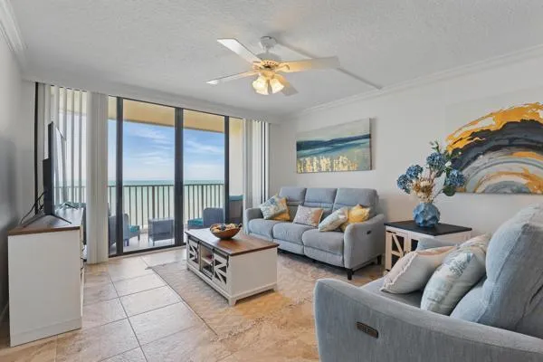 a living room with furniture and a large window