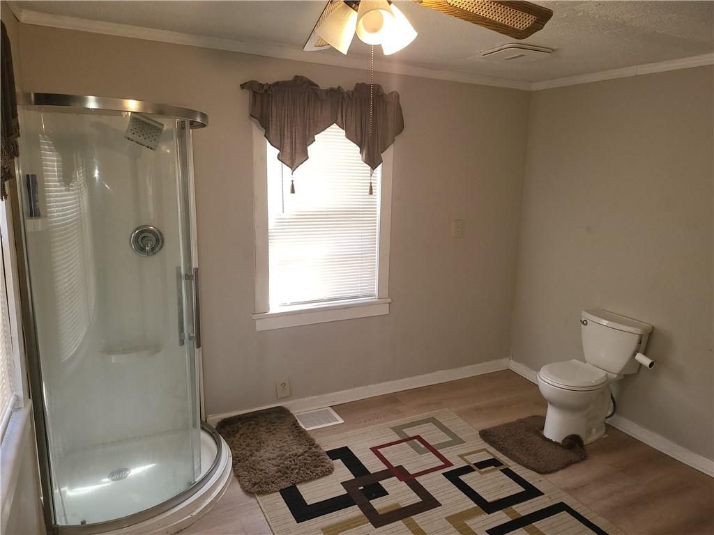 2455 Lake Harbin Road Morrow, GA 30260 - Photo 12 of 28 a bathroom with a toilet and a shower