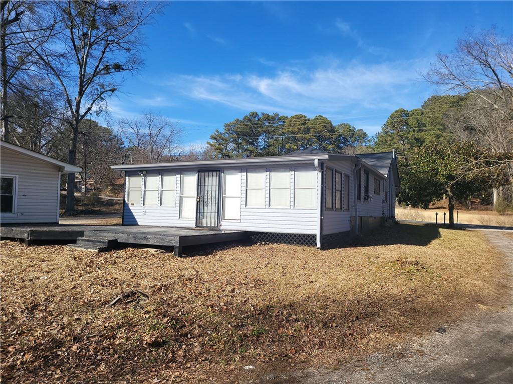 2455 Lake Harbin Road Morrow, GA 30260 - Photo 23 of 28 a view of a house with backyard and sitting area