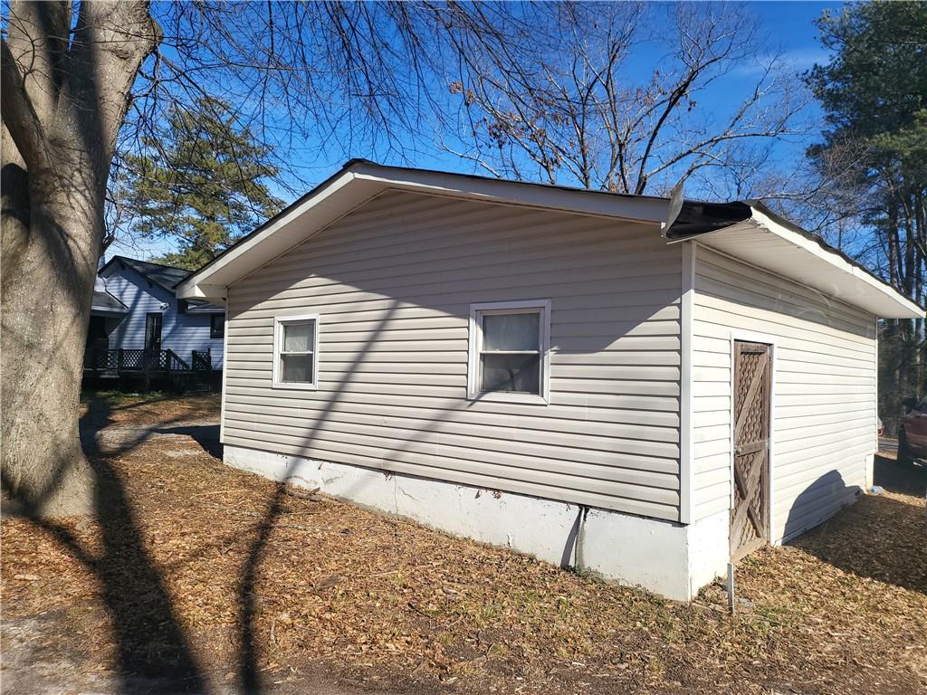 2455 Lake Harbin Road Morrow, GA 30260 - Photo 28 of 28 a view of a house with a yard