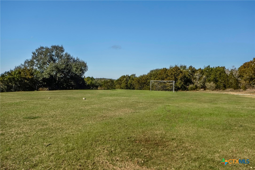 14422 Tuscola Circle Austin, TX 78734 - Photo 18 of 22 a view of a green field with wooden fence