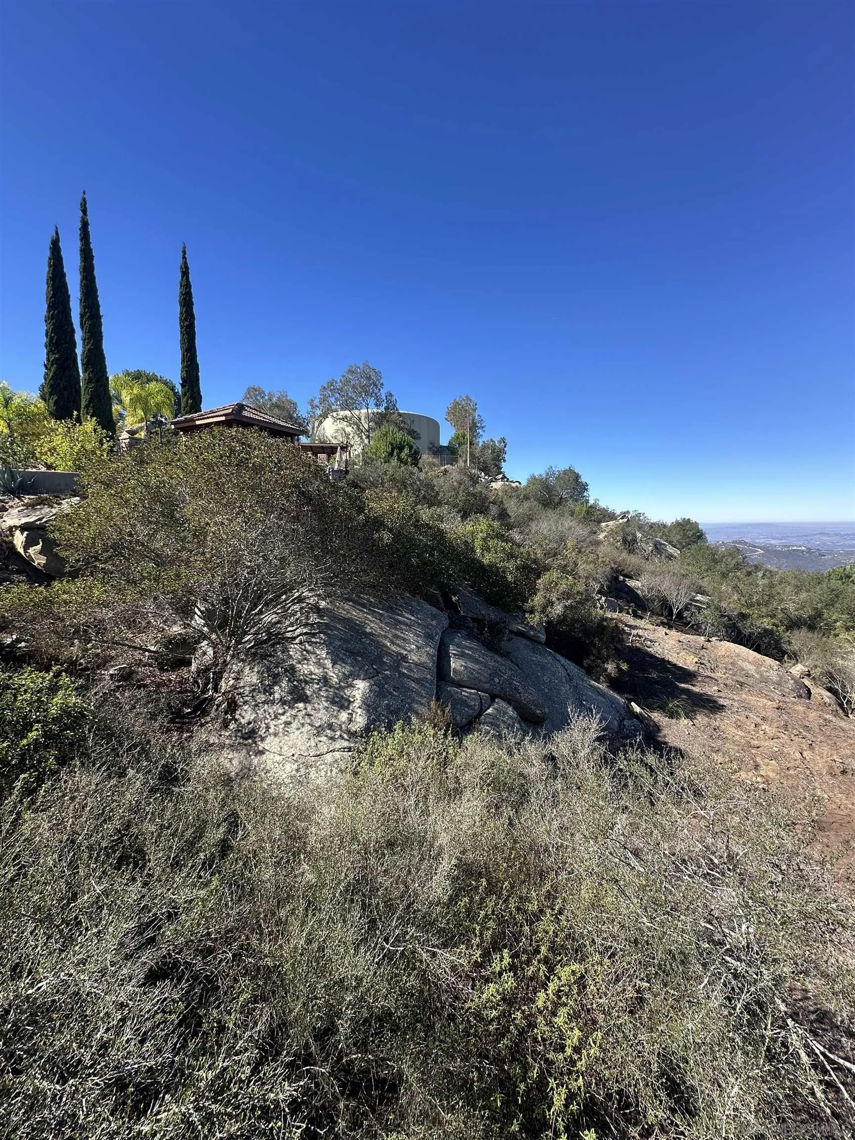 0 Sage Hill Way, Unit 146 Escondido, CA 92025 - Photo 5 of 7 a view of a yard with wooden fence