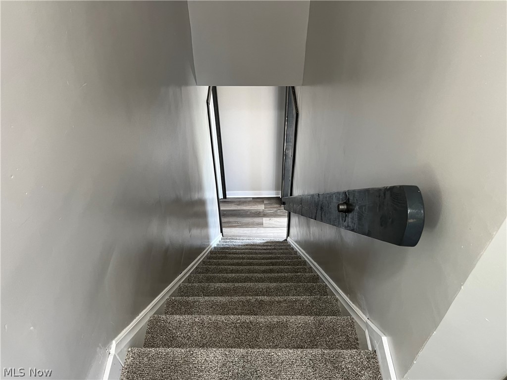 7255 Bagley Road Mount Perry, OH 43760 - Photo 22 of 29 Stairs with carpet flooring