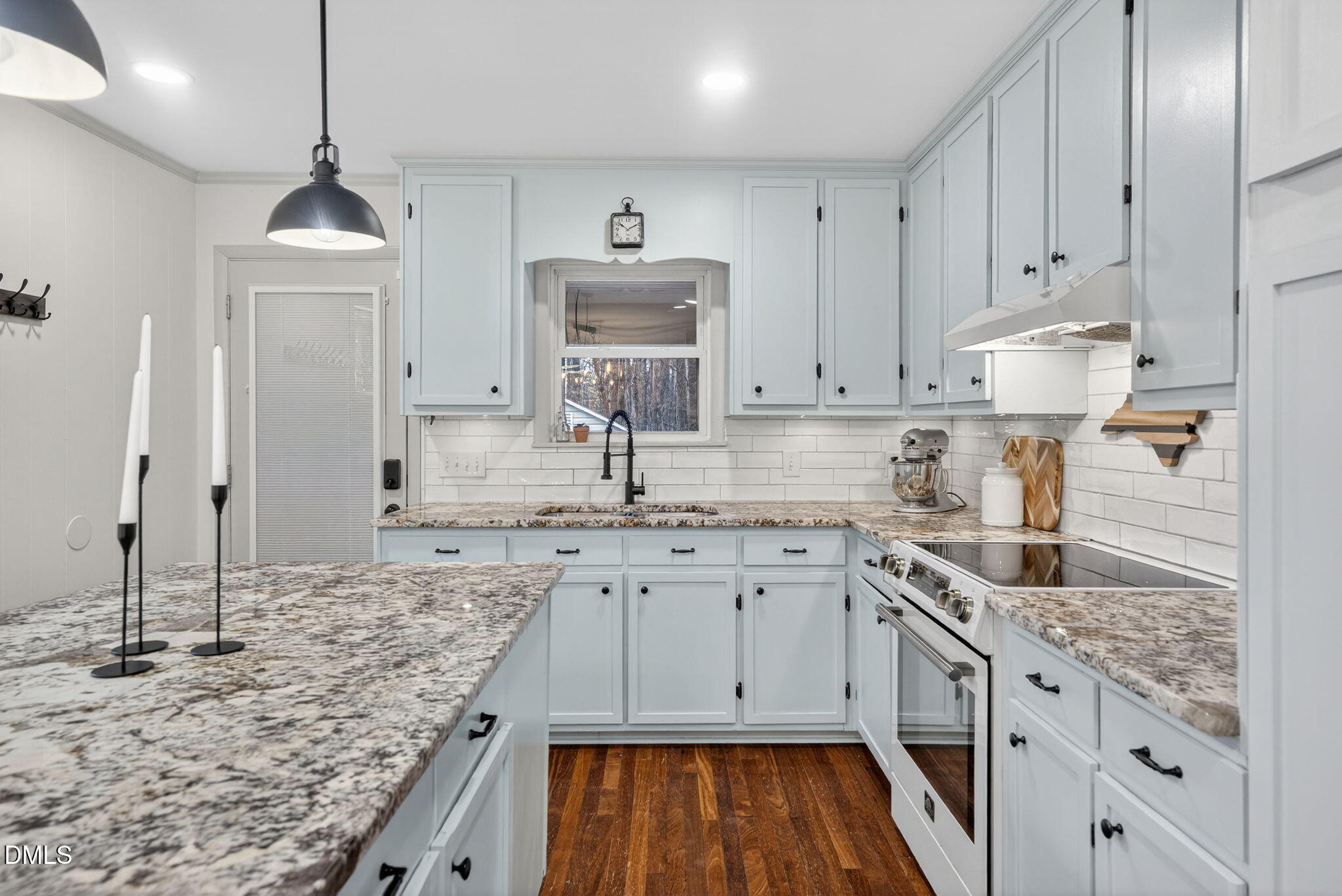 2808 Carpenter Pond Road Raleigh, NC 27613 - Photo 14 of 49 a kitchen with granite countertop white cabinets and a sink