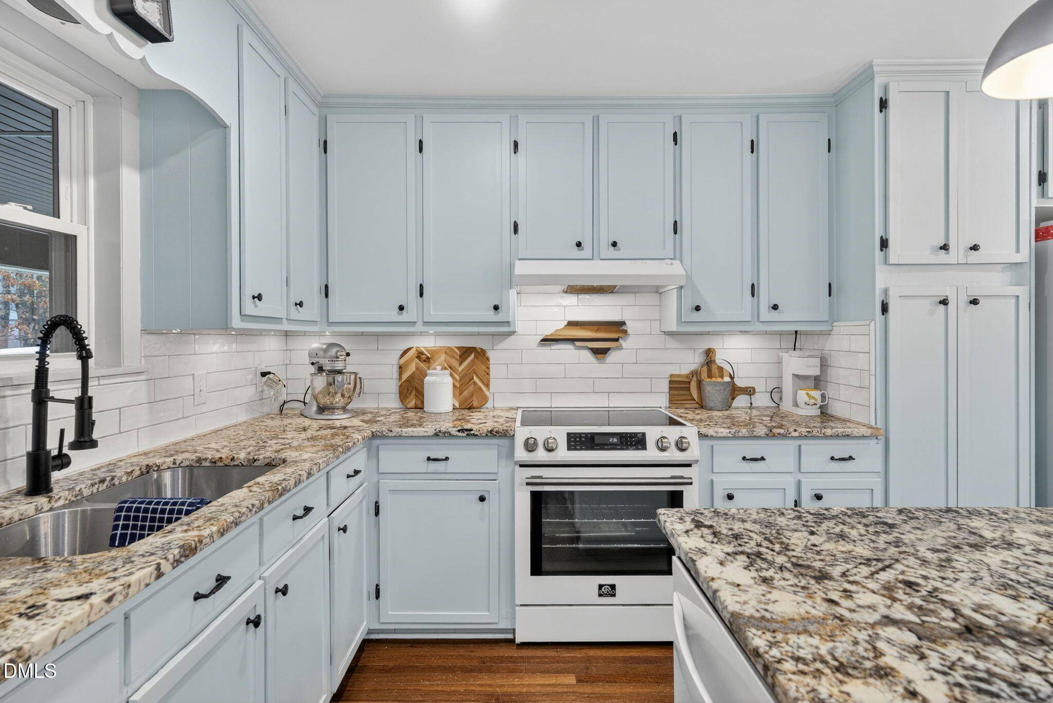 2808 Carpenter Pond Road Raleigh, NC 27613 - Photo 16 of 49 a kitchen with cabinets appliances and a counter space