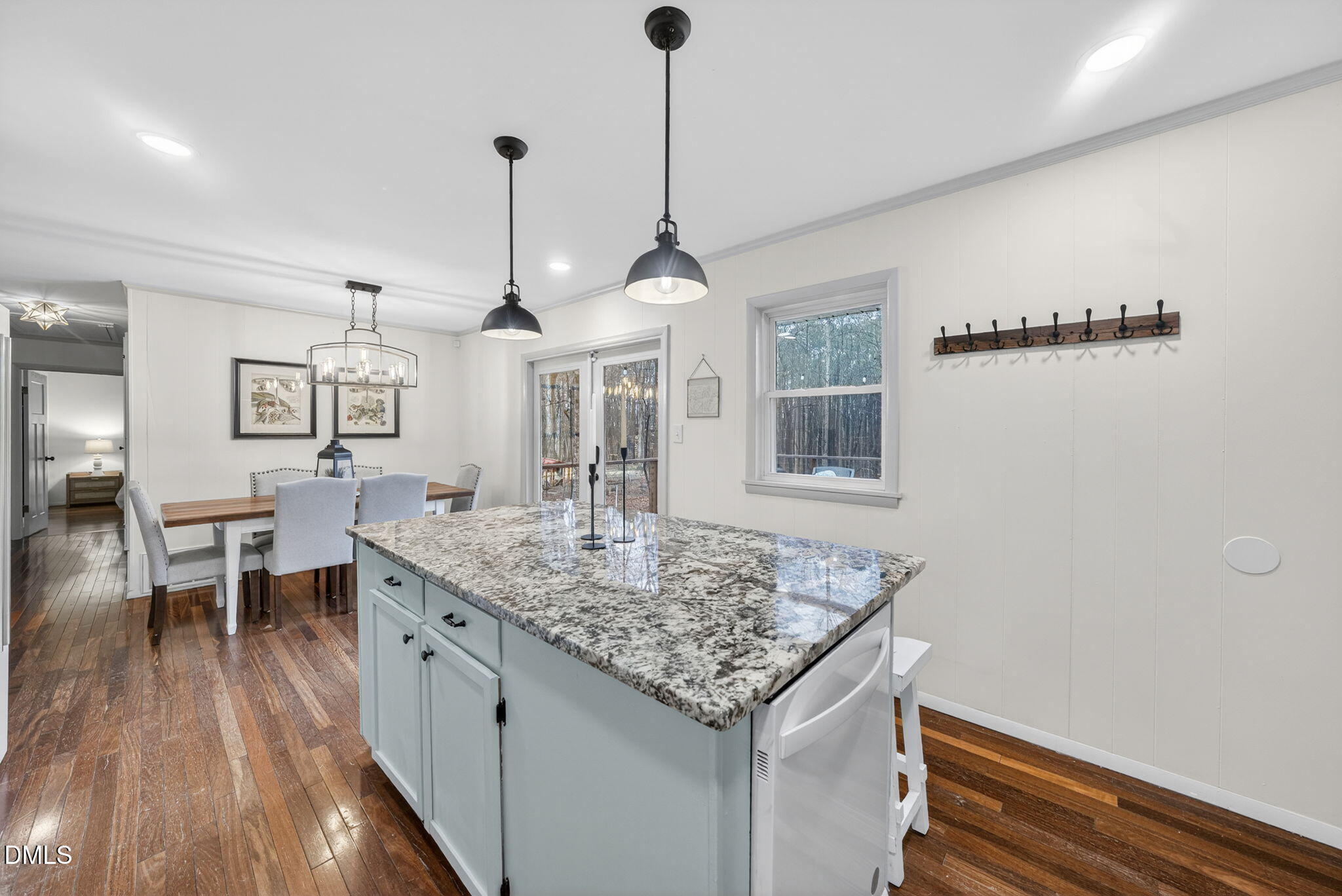2808 Carpenter Pond Road Raleigh, NC 27613 - Photo 17 of 49 a kitchen with center island and wooden floor