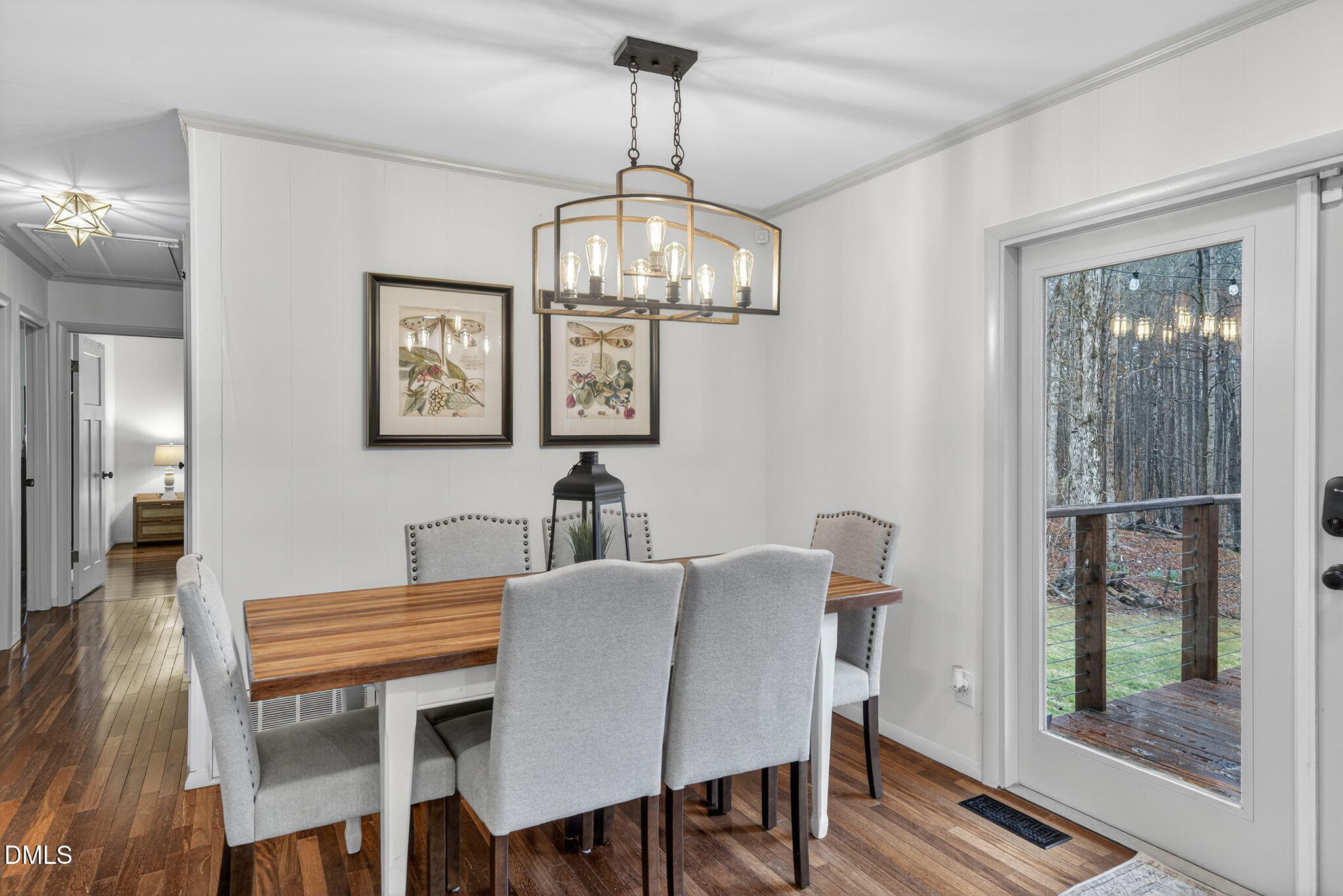 2808 Carpenter Pond Road Raleigh, NC 27613 - Photo 18 of 49 a view of a dining room with furniture wooden floor and chandelier