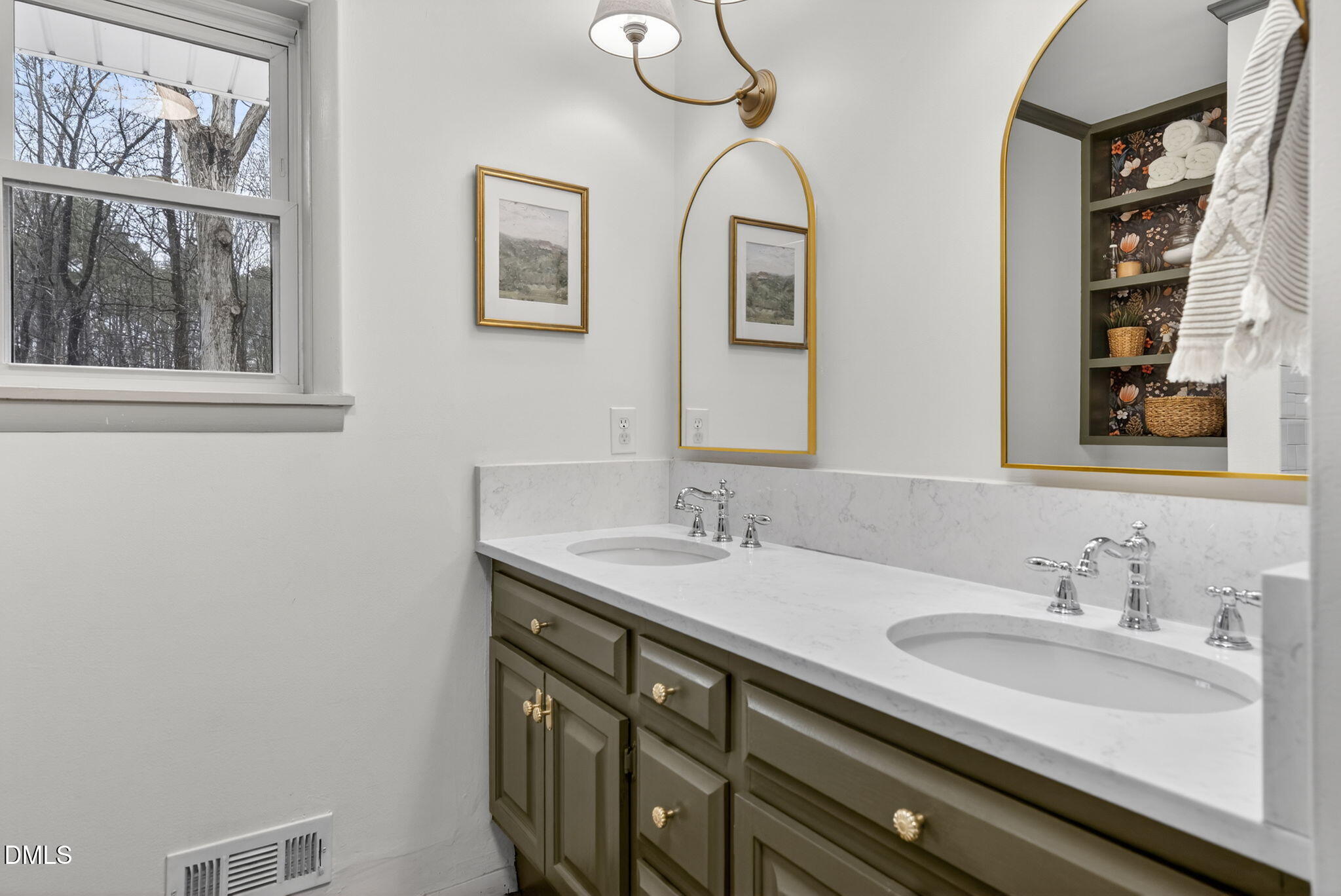 2808 Carpenter Pond Road Raleigh, NC 27613 - Photo 20 of 49 a bathroom with 2 sink and a mirror