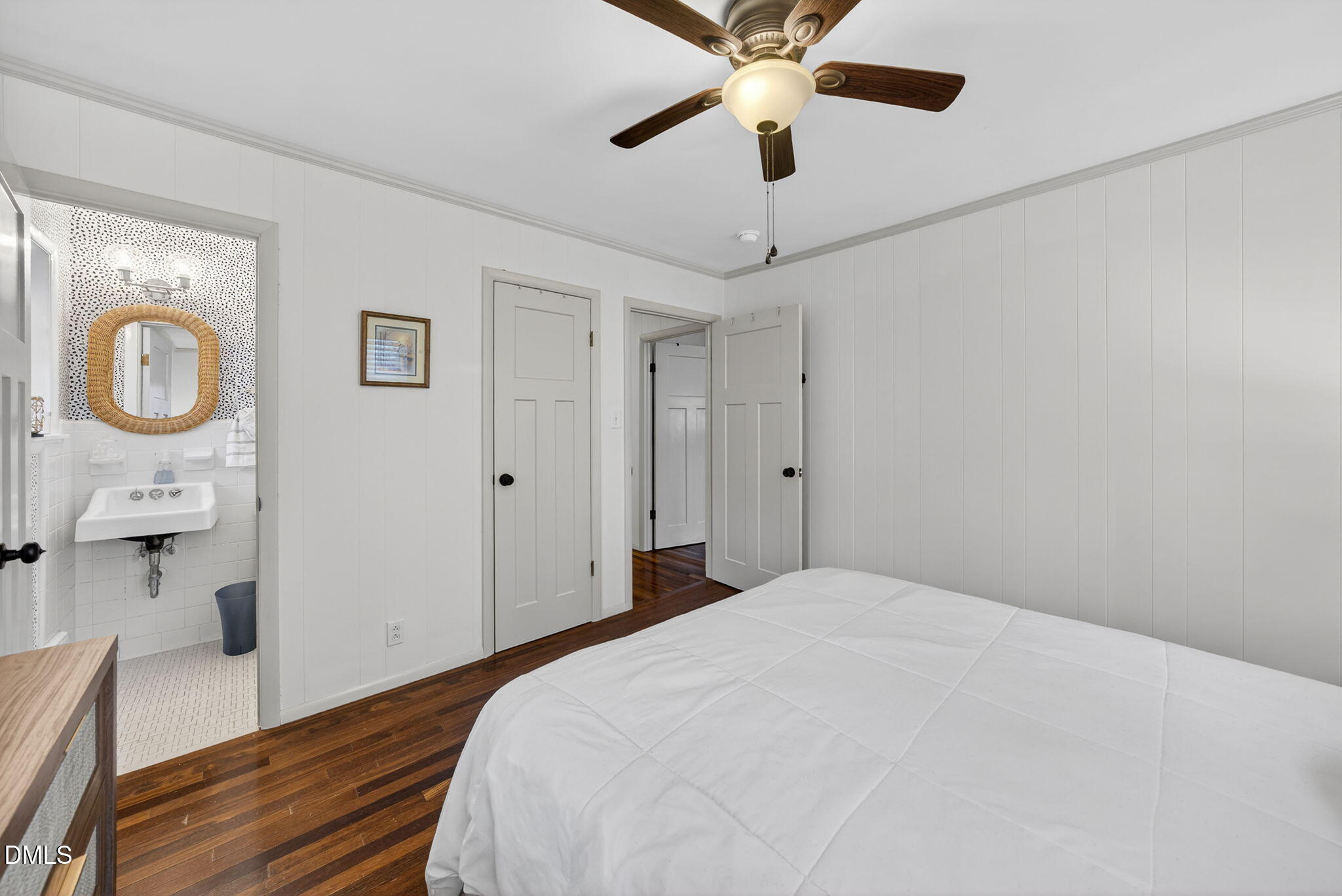 2808 Carpenter Pond Road Raleigh, NC 27613 - Photo 25 of 49 a bedroom with a large bed and a chandelier
