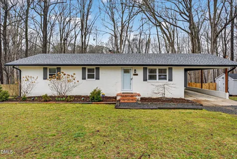 a picture of a bench and a white wall