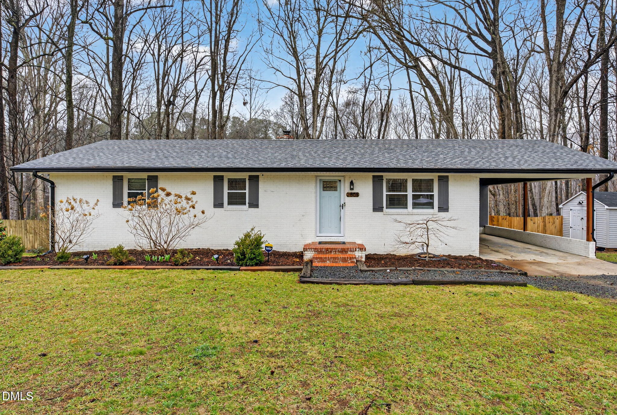 2808 Carpenter Pond Road Raleigh, NC 27613 - Photo 2 of 49 a front view of a house with a garden