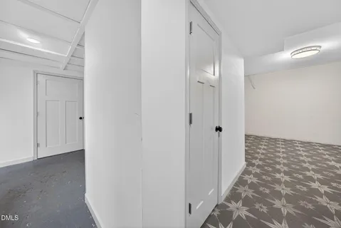 a view of a bathroom with a sink and a mirror